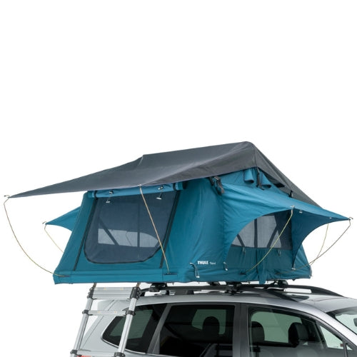 Thule Tepui Explorer Ayer 2 rooftop tent in blue mounted on SUV with rainfly extended and mesh windows open, ideal for 2-person camping in all seasons