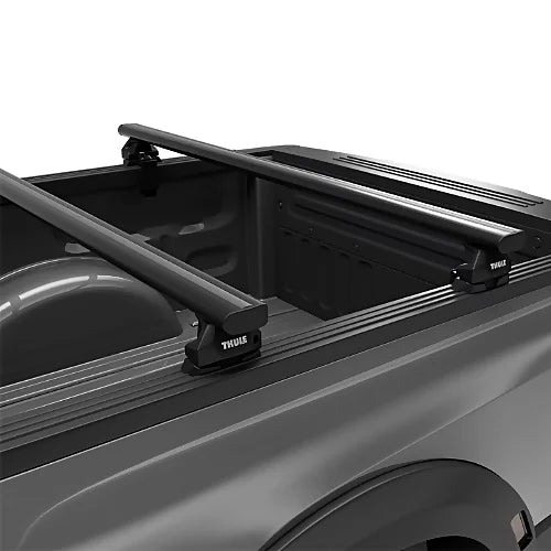 Thule Xsporter Pro Low showing durable mounting feet on full-size pickup truck bed rail