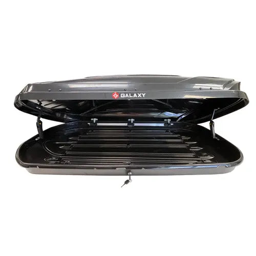 X-Cross Rooftop Cargo Box open with spacious interior for skis snowboards and camping gear