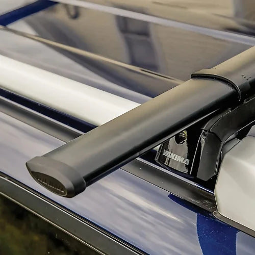 Yakima CoreBar aerodynamic steel roof rack crossbar installed on SUV