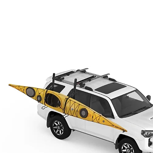 Yakima ShowDown system loading large touring kayak on SUV with load-assist mechanism.