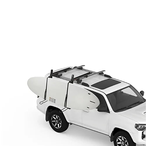 Yakima ShowDown side-loading mount securing paddleboard onto SUV roof rack.
