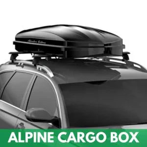 Low-profile alpine cargo box mounted on SUV roof rack for ski and snowboard storage during winter travel