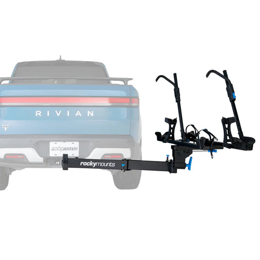 Bicycle rack attached to the back of a Rivian vehicle on a white background