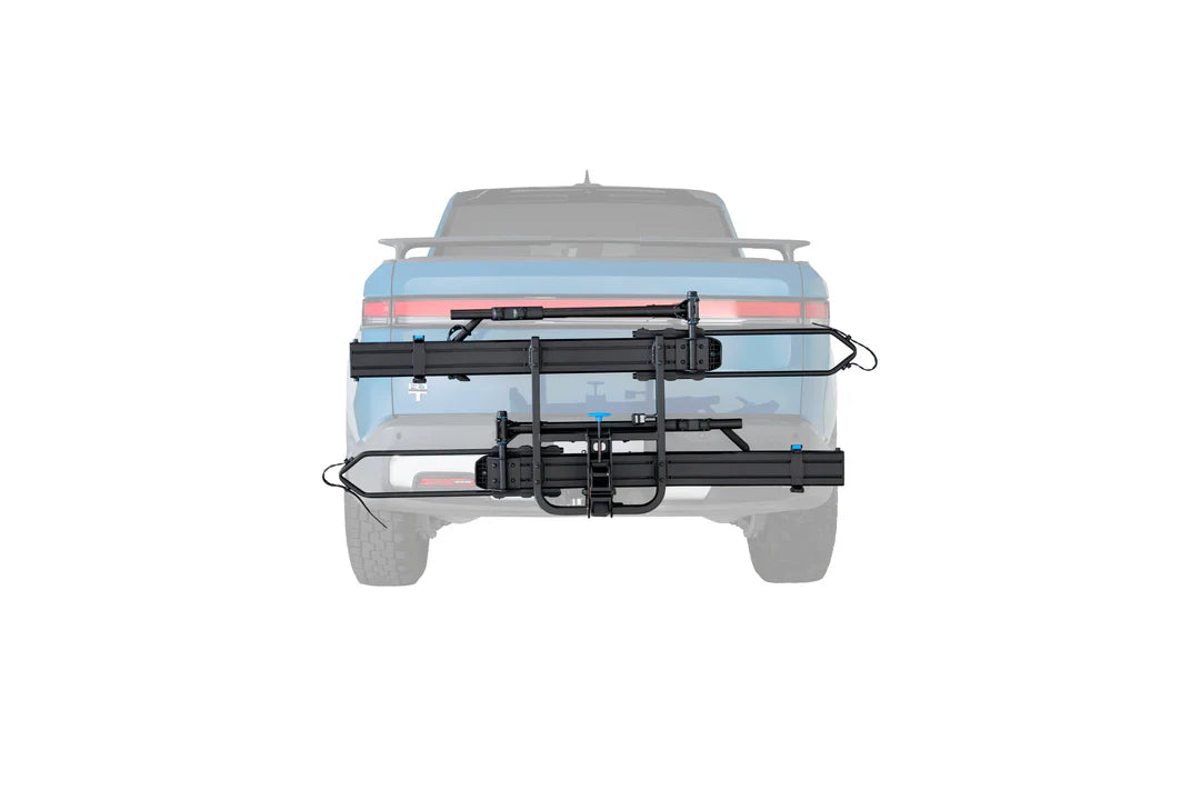 Bicycle rack attached to the back of a vehicle on a white background