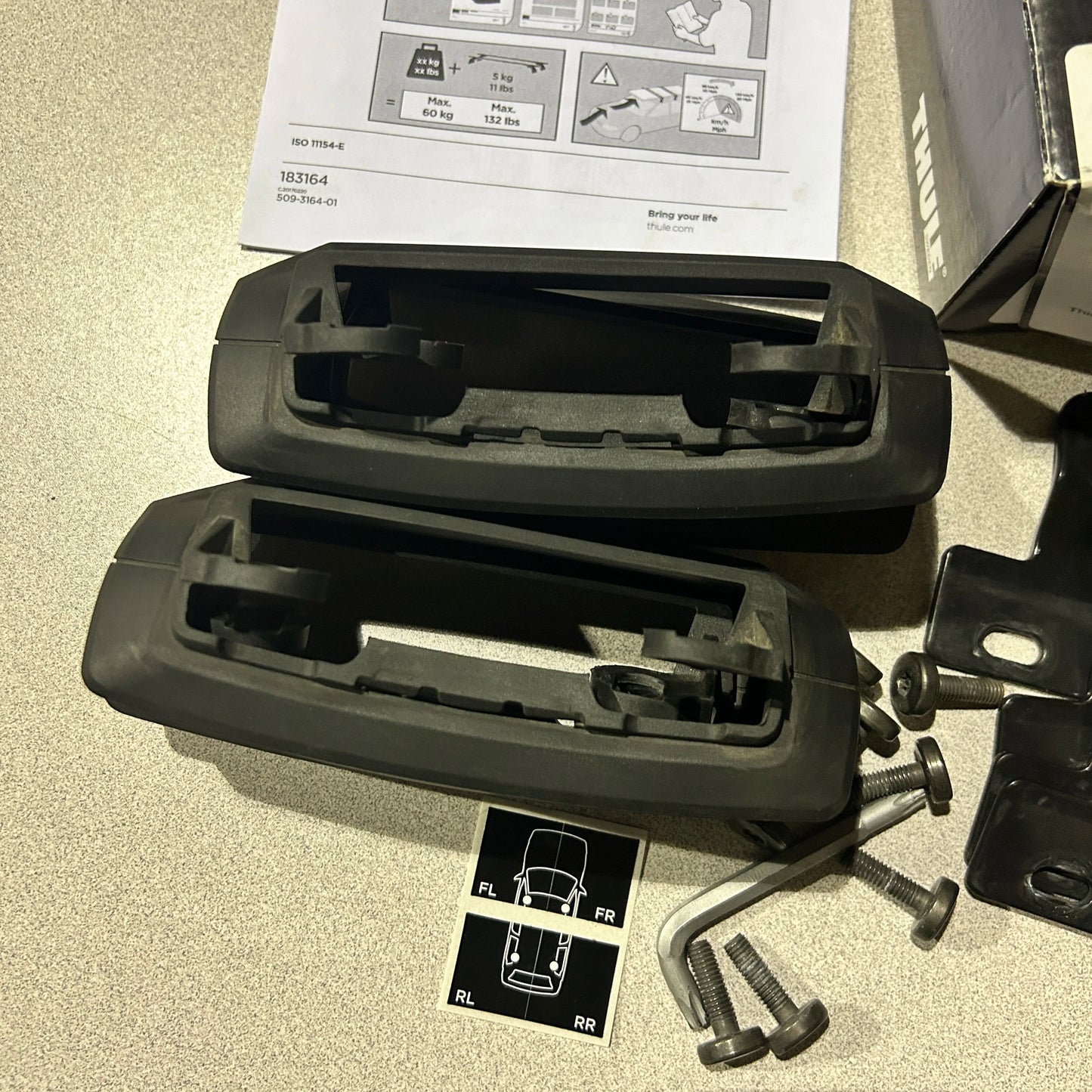 Thule Fit Kit 3164 with two foot pack mounts and screws
