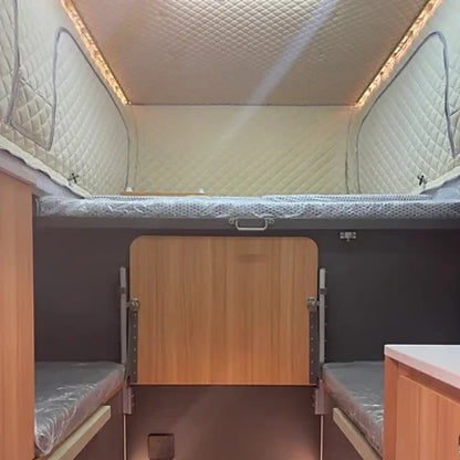 Interior sleeping area with retractable bed platform and insulation