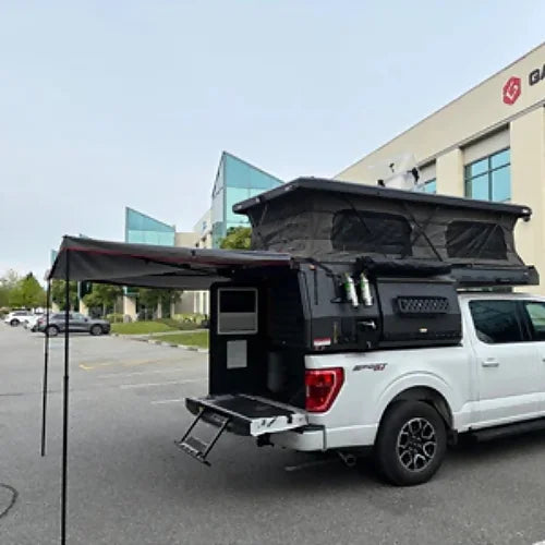 Rear awning and privacy enclosure setup on 4th Gen truck camper