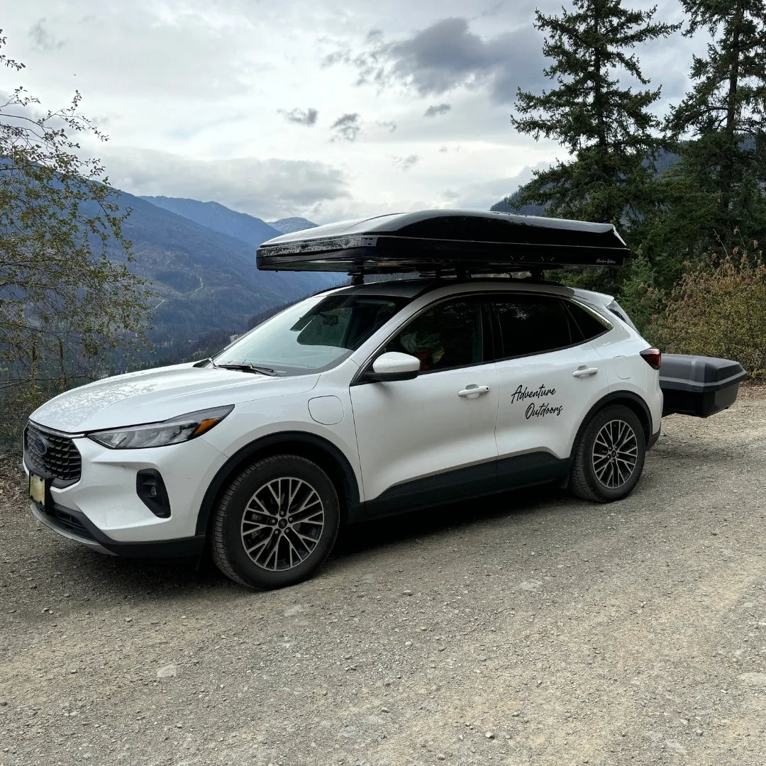 ABS Wedge Clamshell Rooftop Tent foldet on car in mountains