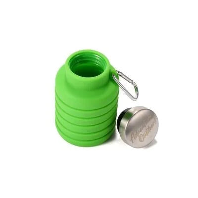Green collapsible silicone water bottle fully collapsed with cap attached
