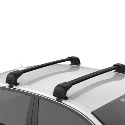 Yakima BaseLine FX integrated crossbars installed on a naked roof vehicle, showing two black aerodynamic roof rack bars mounted directly to the car roof for cargo, bike, and rooftop carrier transport.