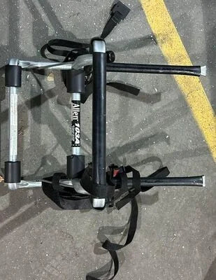 Close-up of Allen 103A bike rack frame and straps on pavement

