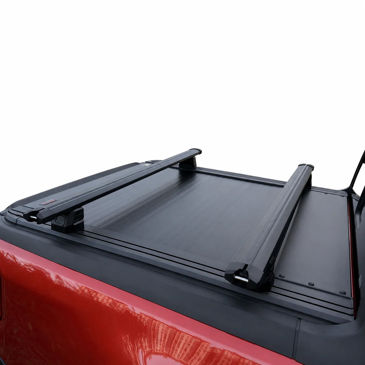 Black roof rack on a red vehicle with a white background