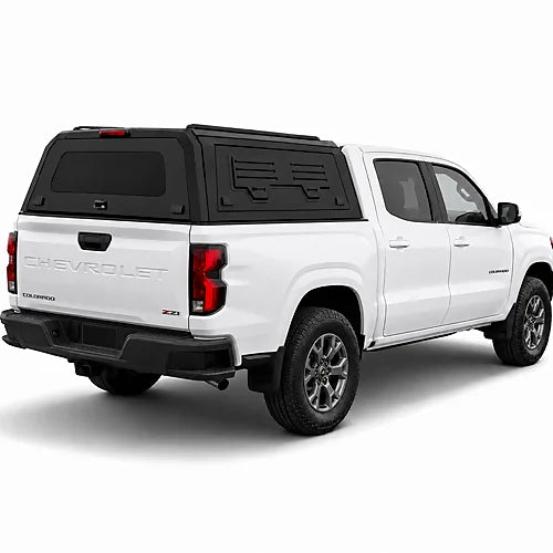GullWing aluminum truck cap with tinted rear glass and lockable side doors on an overland pickup truck