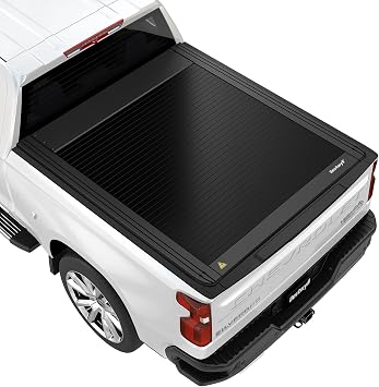 Retractable hard tonneau cover shown on a pickup truck bed with a low-profile matte black finish.