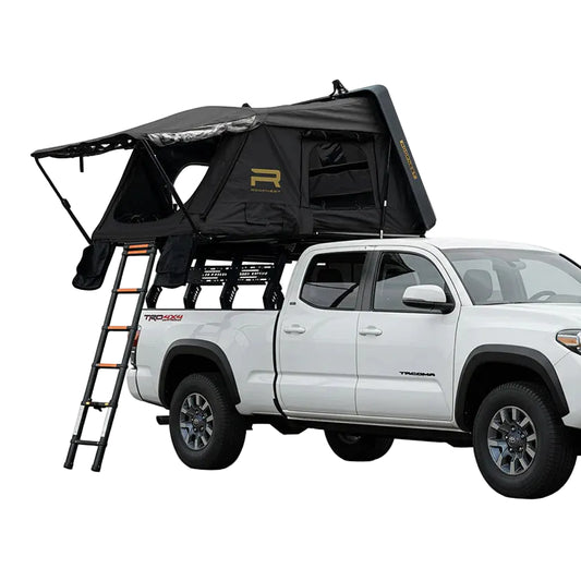 Black Condor 2 XL Air rooftop tent opened on a pickup bed rack with ladder deployed and window awnings extended.