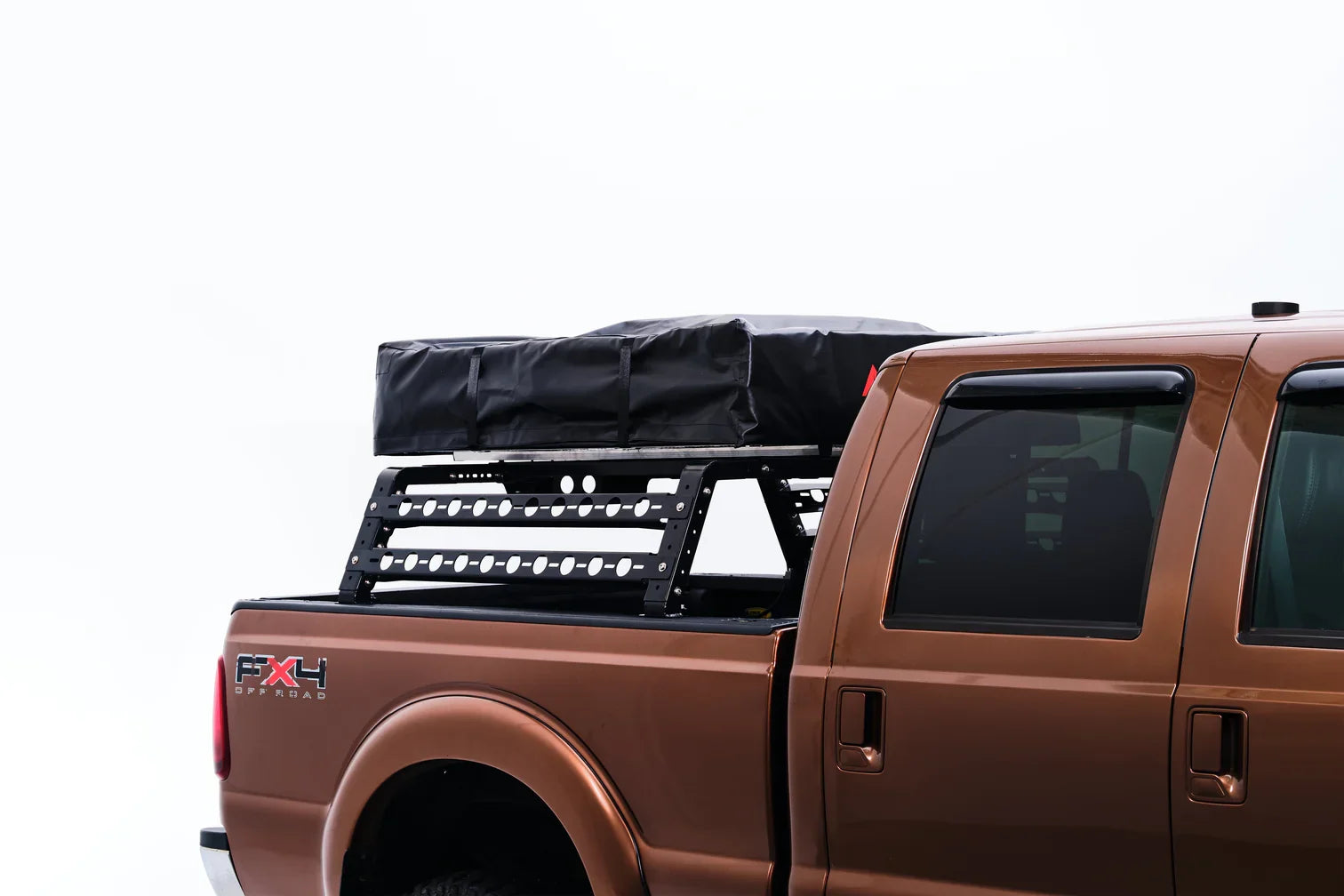 Brown pickup truck with a black cargo bed cover and FXR logo on a white background
