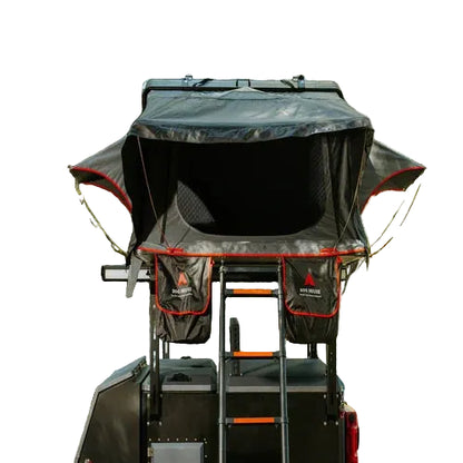Roof top tent on a vehicle with a white background