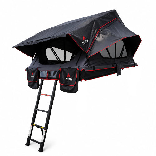 Taiga Hybrid Folding Rooftop Tent open on a black SUV with ladder extended in a wooded outdoor setting.