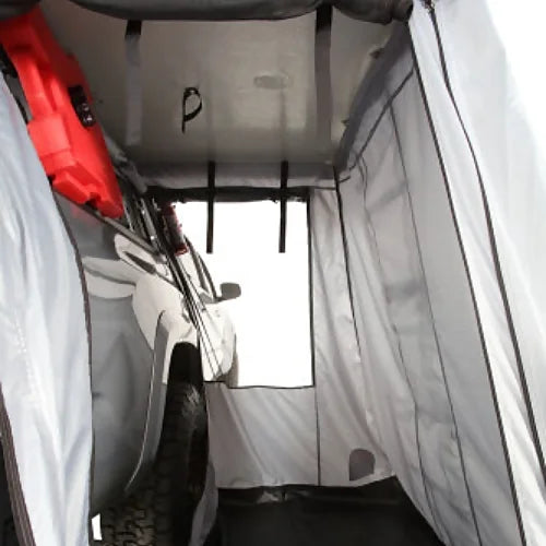 Interior view of Enthuze Annex Room for Rooftop Tent showing spacious waterproof walls, vehicle access, and durable flooring