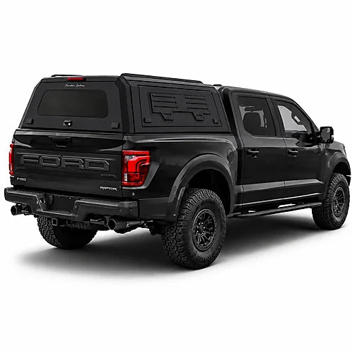 GullWing aluminum truck cap with tinted rear glass and lockable side doors on an overland pickup truck