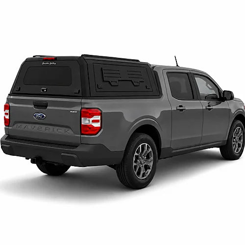 GullWing aluminum truck cap with tinted rear glass and lockable side doors on an overland pickup truck