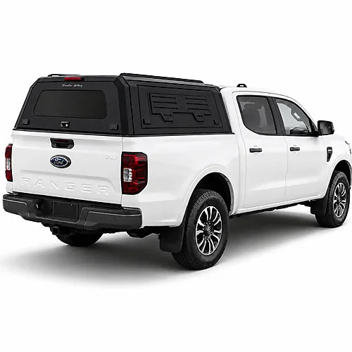 GullWing aluminum truck cap with tinted rear glass and lockable side doors on an overland pickup truck