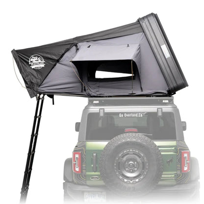 Roof top tent attached to a vehicle with 'Go Overland' branding.