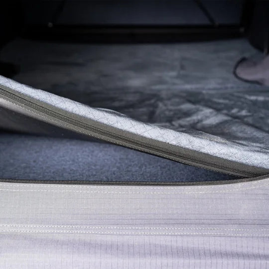 inside of go overland expedition mini rooftop tent featuring mattress and anti condensation mat