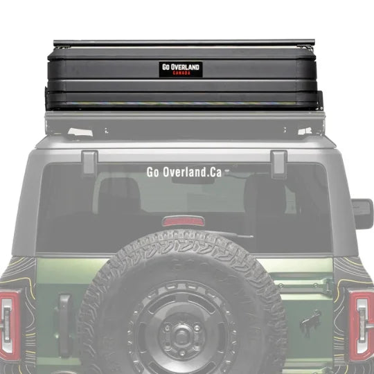 offroad ready Roof rack system and rooftop tent on a vehicle with 'Go Overland' branding.