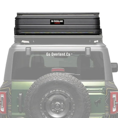 offroad ready Roof rack system and rooftop tent on a vehicle with 'Go Overland' branding.