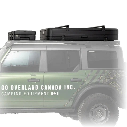 Green SUV with roof racks, cargo case, and rooftop tent and 'GO OVERLAND CANADA INC.' branding on a white background
