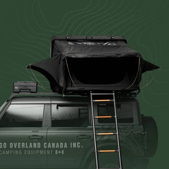 Roof top tent on a vehicle with a ladder, branded 'Go Overland Canada Inc.'