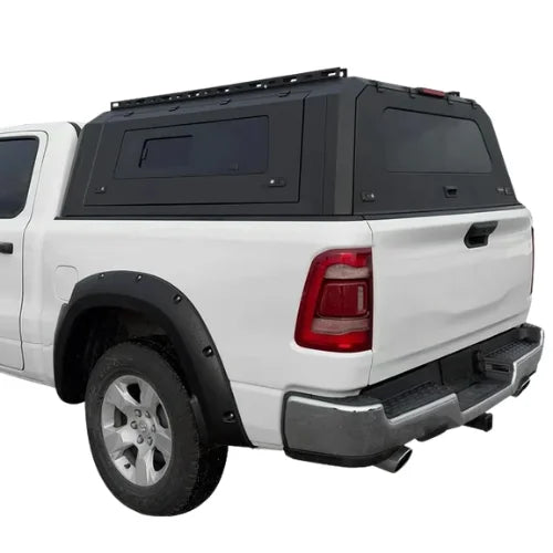 nissan frontier gullwing aluminum truck cap with sliding windows and truck canopy on a white nissan frontier