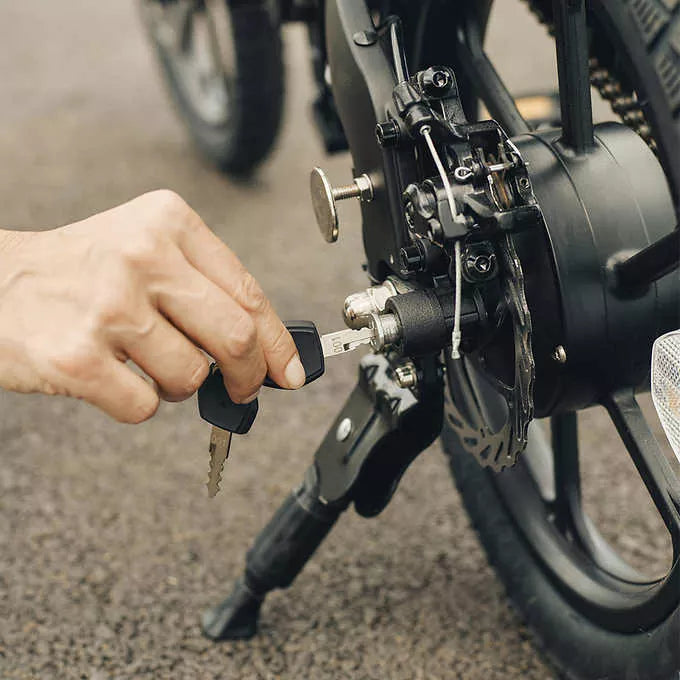 Close-up of hand adjusting kick stand on Jetson Haze E-Bike