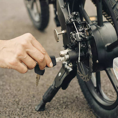 Close-up of hand adjusting kick stand on Jetson Haze E-Bike