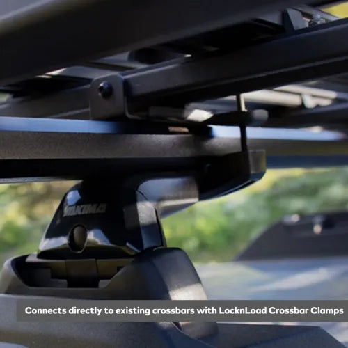 Close-up of a bike rack with LocknLoad Crossbar Clamps on a blurred outdoor background.