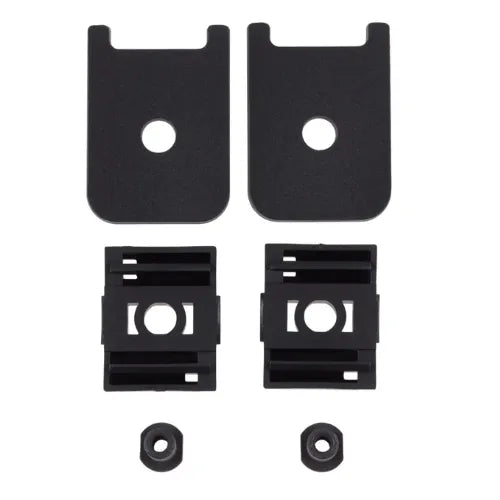 Set of black metal brackets and washers on a white background