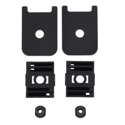 Set of black metal brackets and washers on a white background