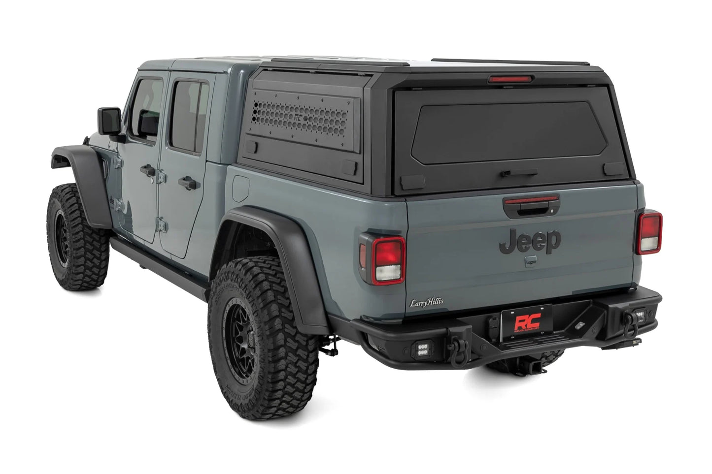 Gray Jeep Gladiator with a hard lid on a white background