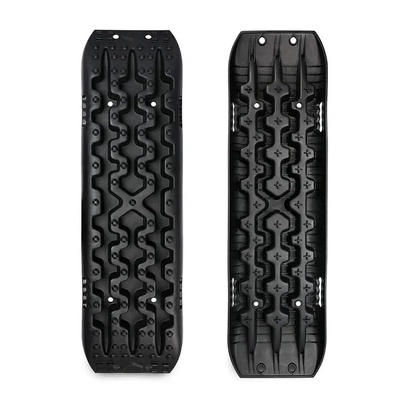 Top-down view of two black recovery traction boards side by side on white background.