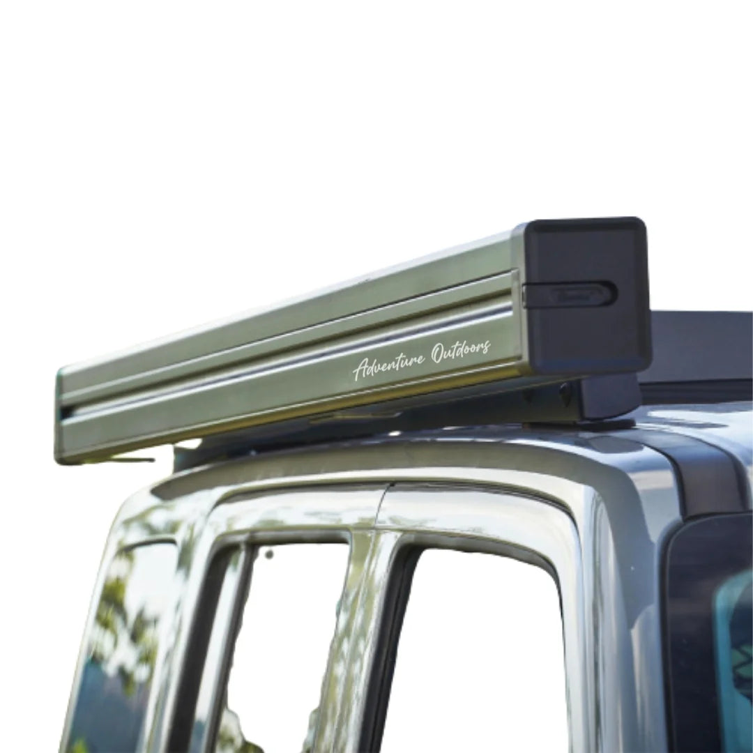 car roof top awning with Adventure Outdoors branding on it mounted to a suv