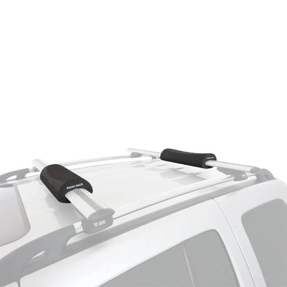 Rhino-Rack Vortex Foam Wrap Pads installed on silver vehicle roof crossbars.