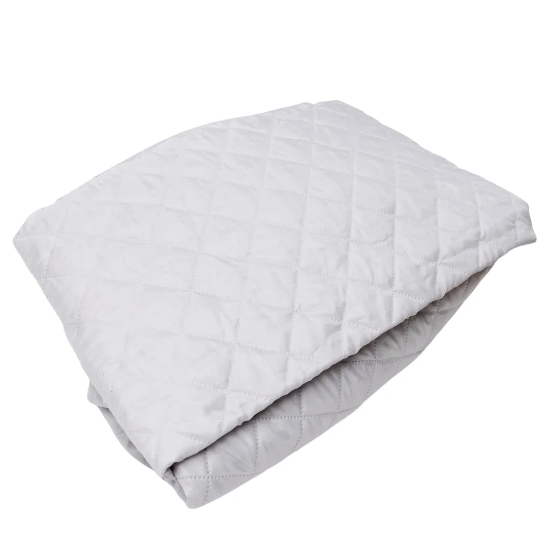 folded silver quilted insulation liner for rooftop tents on a white background