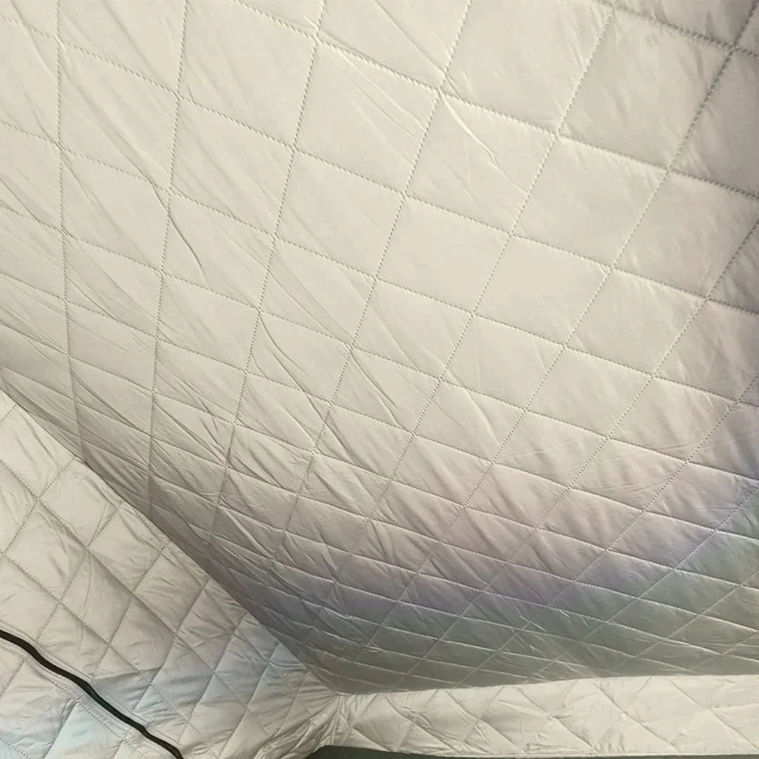 installed white quilted insulation layer for rooftop tents insite an rtt