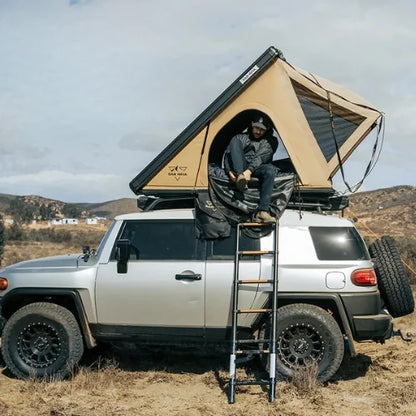 San Hima Hotham Lite Aluminum Rooftop Tent - Lightweight Slim Clamshell Tent beige colour being used on a camp site