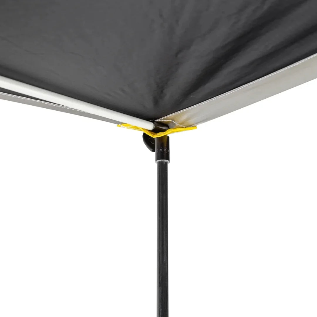 Close-up of a awning fabric and poles setup with black fabric and metal poles on a white background