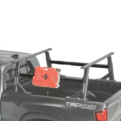 Truck bed with a black rack and an orange toolbox on a white background