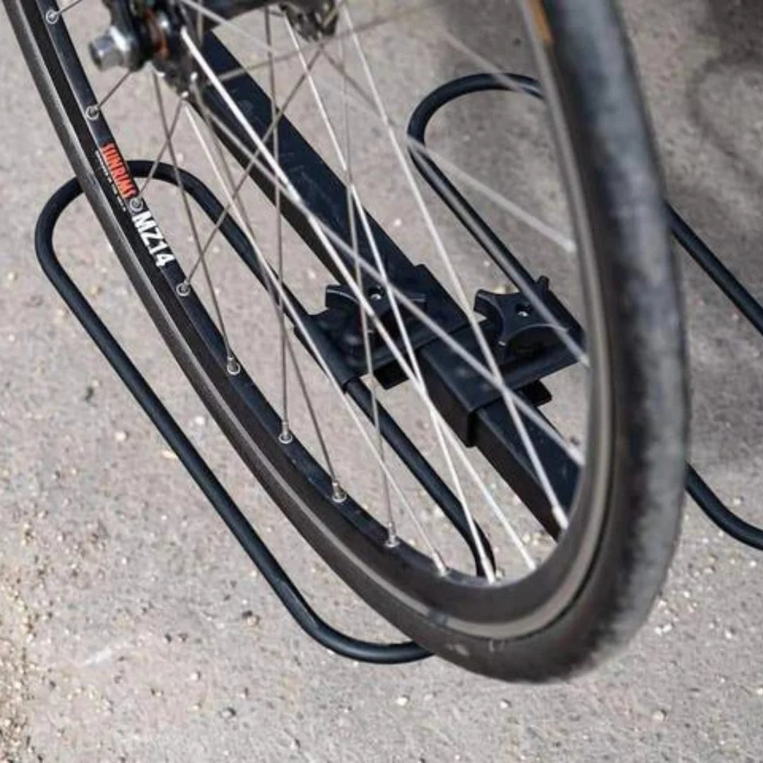 Close-up of a bicycle wheel secured in the Swagman XC2’s adjustable wheel hoop.