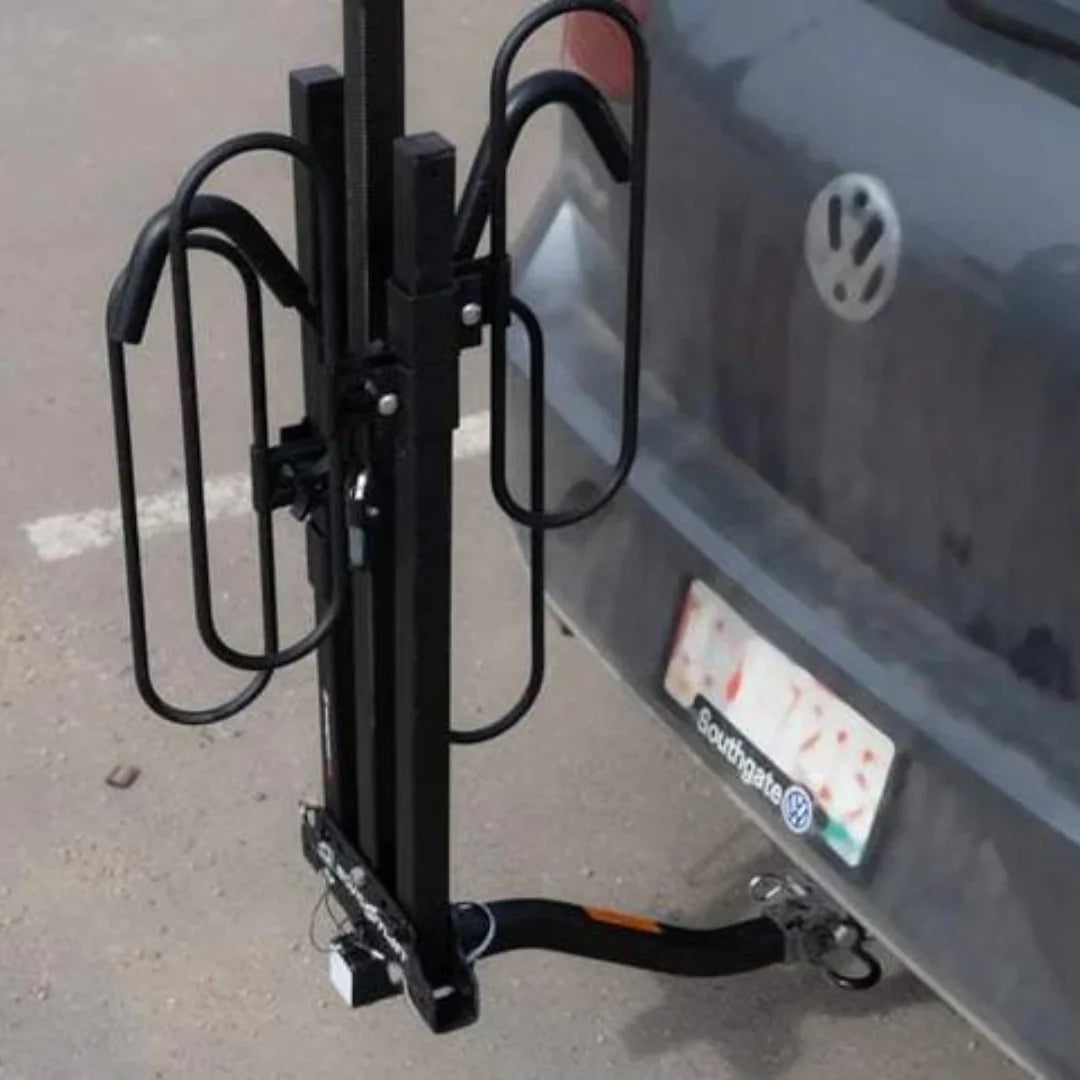 Side angle of the Swagman XC2 bike rack folded upright on a vehicle hitch.